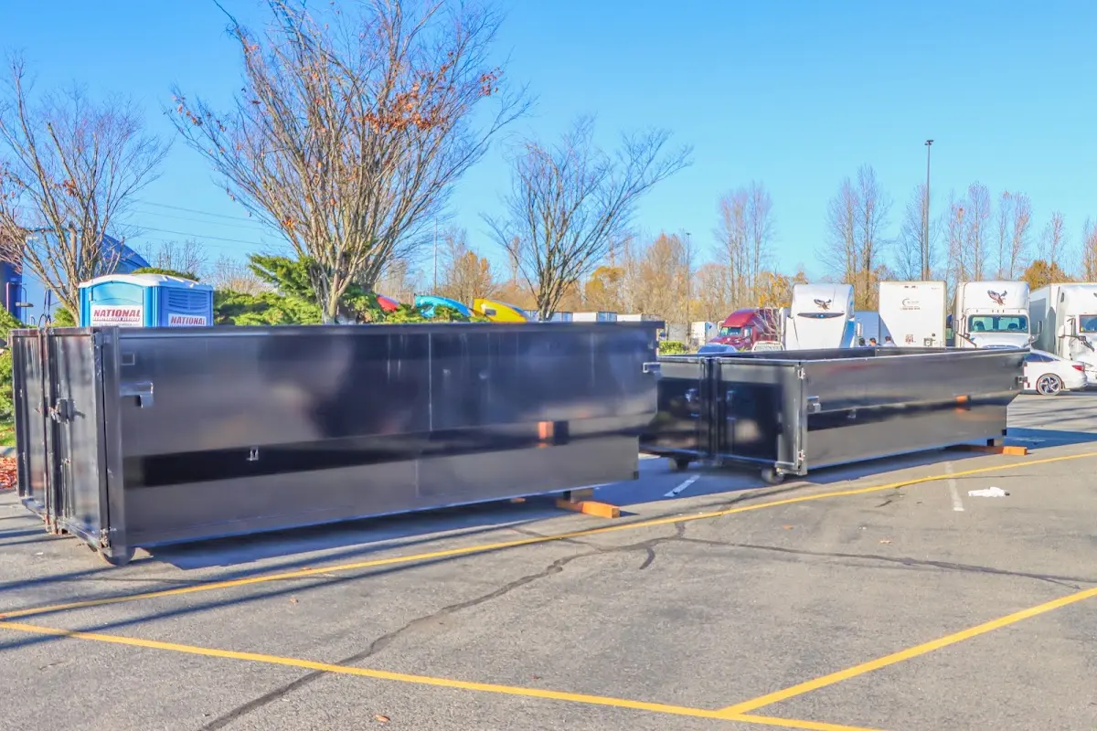 Professional dumpster rental service with roll-off container on residential driveway in Bolingbrook